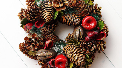 Image showing Christmas Wreath on White Wooden Background