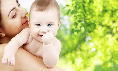 Image showing mother with baby over green natural background