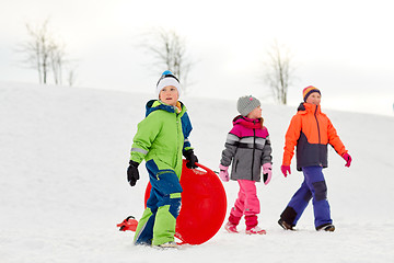 Image showing happy little kids with outdoors in winter