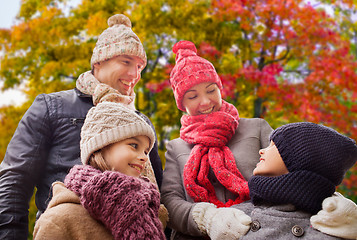 Image showing happy family over autumn park background