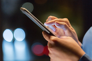 Image showing close up of businesswoman hands with smartphone