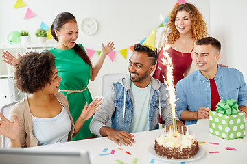 Image showing office team greeting colleague at birthday party