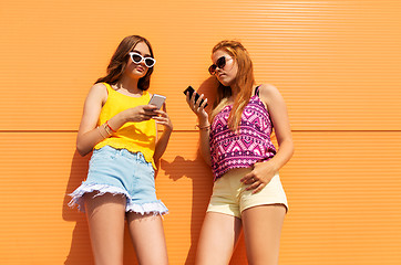 Image showing teenage girls with smartphones in summer outdoors