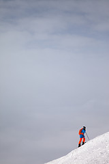 Image showing Skier before downhill on freeride slope and overcast misty sky