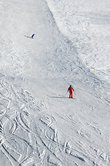 Image showing Skier and snowboarder downhill on ski slope 