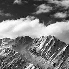 Image showing Black and white snow winter mountains and sunlight cloud sky in 