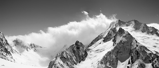 Image showing Black and white panoramic view on snow mountains