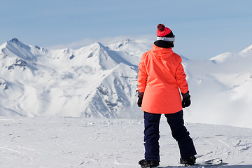 Image showing Snowboarder on top of mountain before downhill 