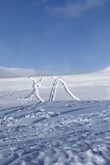 Image showing Off-piste ski slope with new-fallen snow and traces from skis, s