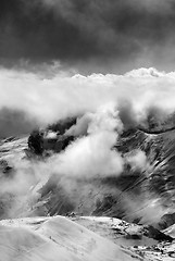 Image showing Black and white view on ski resort in mist and sunlight sky befo