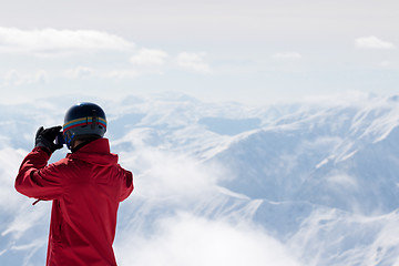 Image showing Snowboarder makes photo on camera 