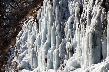 Image showing Icy mountain waterfall at nice sun day