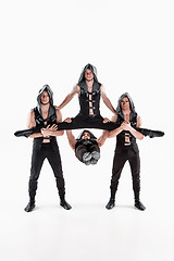 Image showing The group of gymnastic acrobatic caucasian men on balance pose