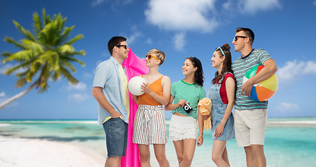 Image showing happy friends with beach and summer accessories