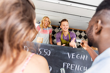 Image showing customers giving credit card at food truck seller