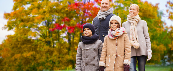 Image showing happy family over autumn park background