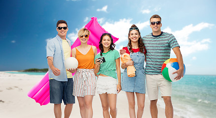 Image showing happy friends with beach and summer accessories