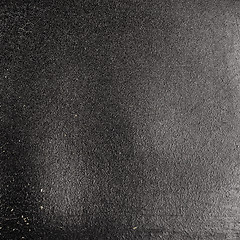 Image showing Old grunge black paper with paint peeling of.