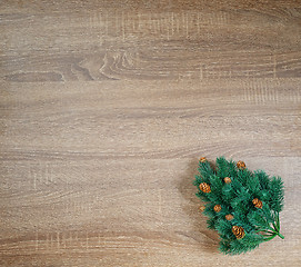 Image showing Christmas tree on brown wooden texture background.