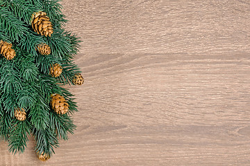 Image showing Christmas tree on brown wooden texture background.