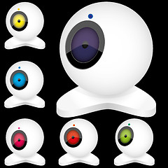 Image showing Set of white webcams with bright lights in different positions, isolated on black, part 5