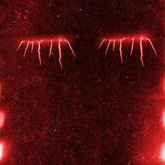 Image showing Black and red textured background with light leaks and grain.