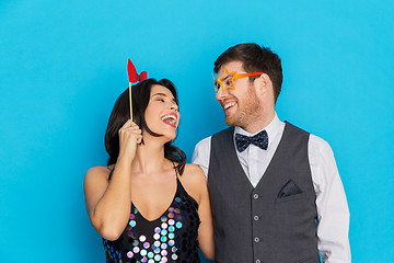 Image showing happy couple with party props having fun