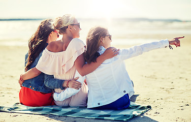 Image showing group of smiling women in sunglasses on beach