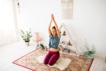 Image showing woman meditating at yoga studio