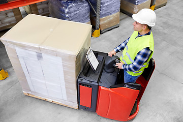 Image showing loader operating forklift at warehouse