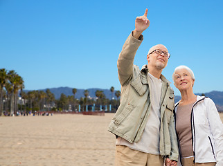 Image showing happy senior couple over venice beach background