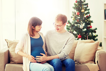 Image showing pregnant wife with husband at home at christmas