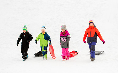 Image showing happy little kids with sleds in winter