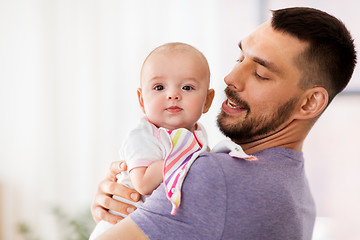 Image showing father with little baby girl at home