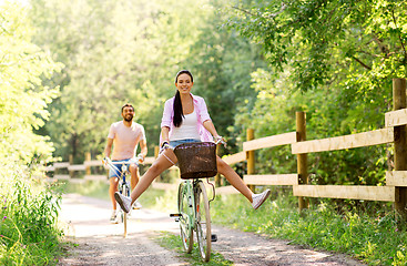 Image showing happy couple with bicycles at summer park