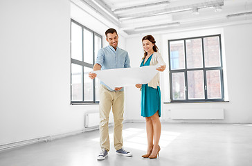 Image showing happy couple with blueprint at new home