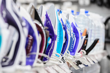 Image showing row of electric irons in retail store