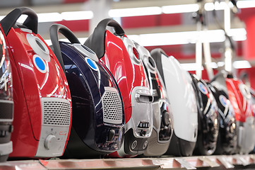 Image showing Row of vacuum cleaners in appliance store