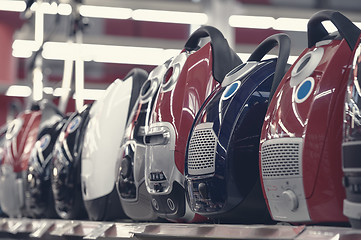 Image showing Row of vacuum cleaners in appliance store