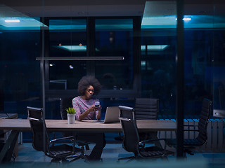 Image showing black businesswoman using a laptop in startup office