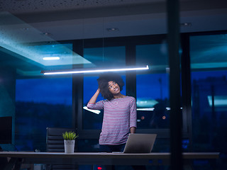 Image showing black businesswoman using a laptop in startup office