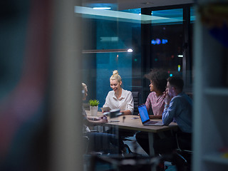 Image showing Multiethnic startup business team in night office