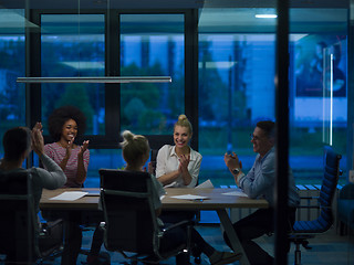 Image showing Multiethnic startup business team in night office