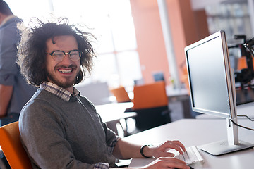 Image showing businessman working using a computer in startup office