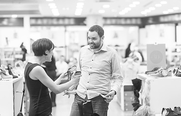 Image showing couple chooses shoes At Shoe Store