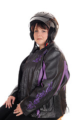 Image showing Smiling woman with helmet and jacket