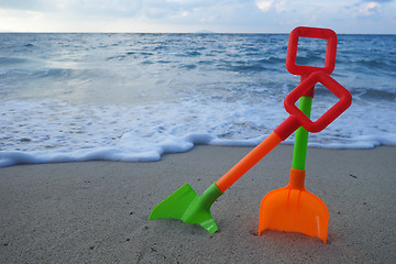 Image showing Toys on the beach sand