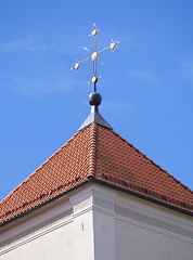 Image showing Golden cross on red tile roof