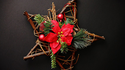 Image showing Christmas wreath with dry twigs, pine branches, red balls