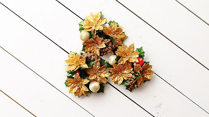 Image showing Christmas Wreath on White Wooden Background